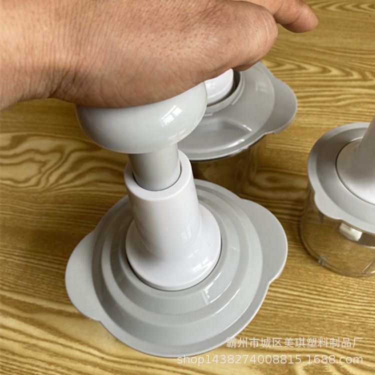 Hand-operated vegetable chopper for home kitchen use