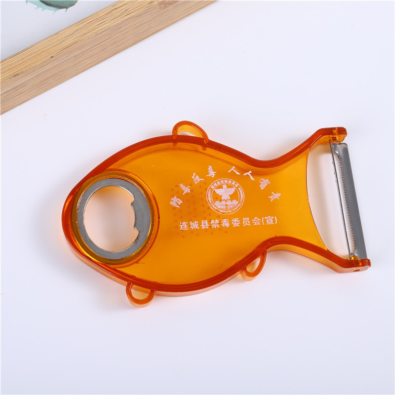 Fish-shaped stainless steel fruit peeler, transparent