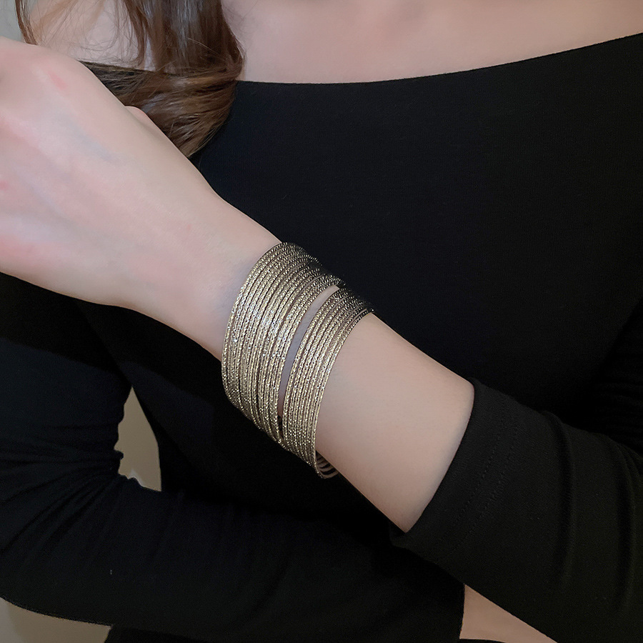 Metal geometric open bangle, gold tone