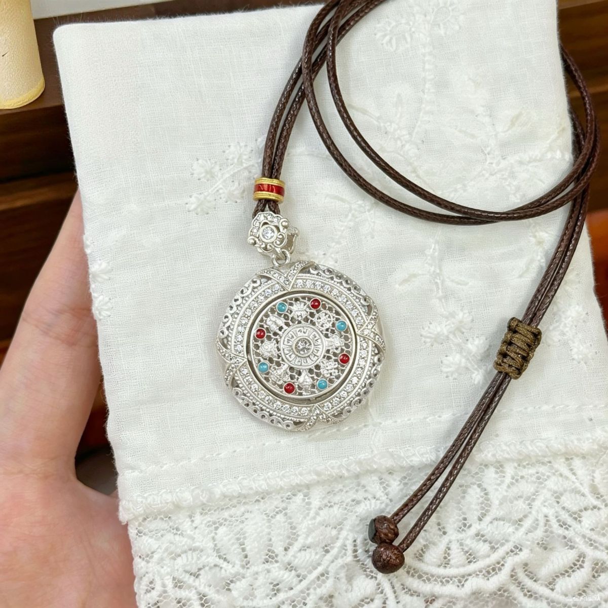 Silver rotatable Eight Treasures compass pendant, long sweater chain