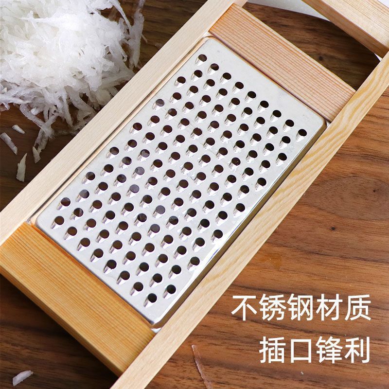 Stainless steel vegetable grater with wooden handle, round hole design