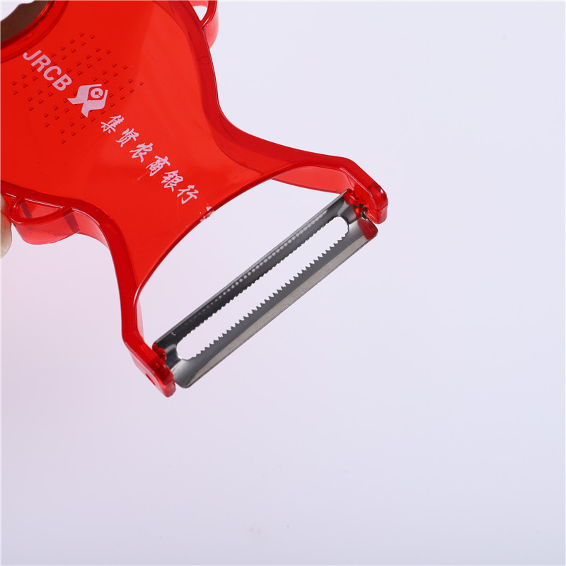 Fish-shaped stainless steel fruit peeler, transparent