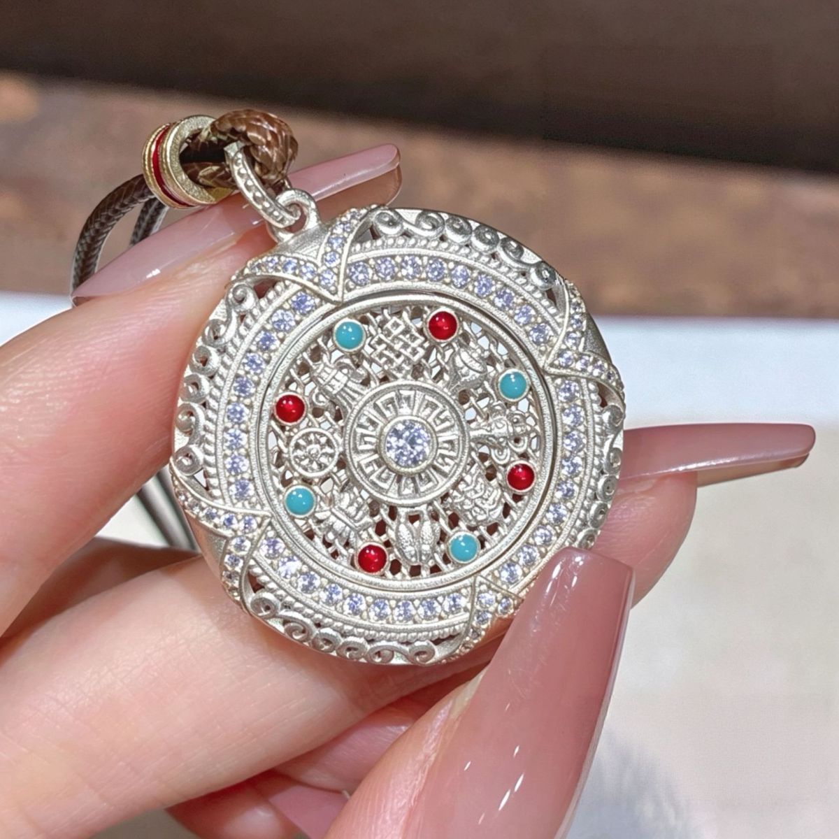 Silver rotatable Eight Treasures compass pendant, long sweater chain