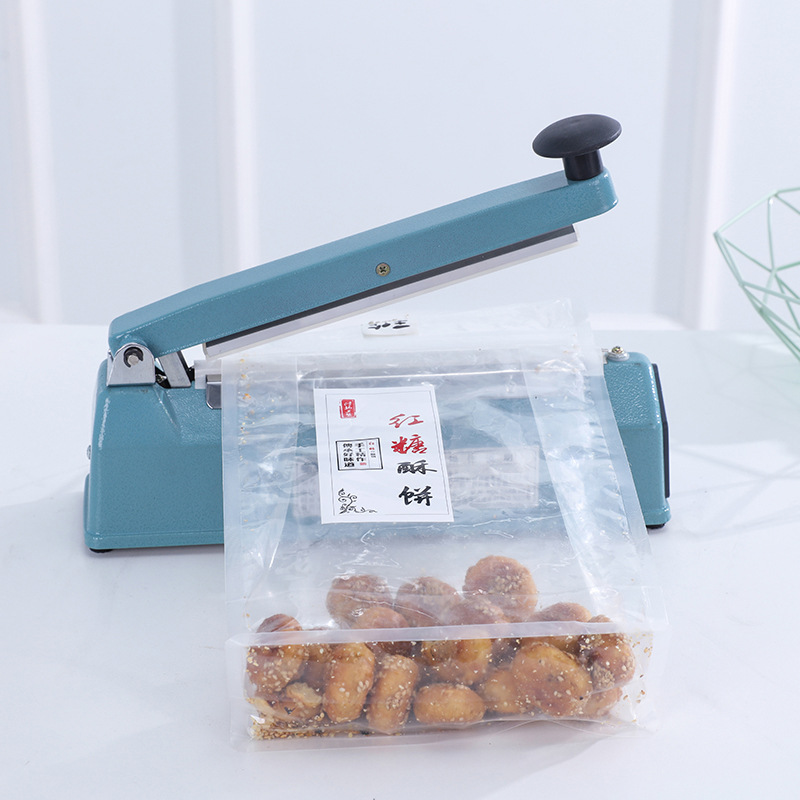 Manual heat sealing machine for food packaging
