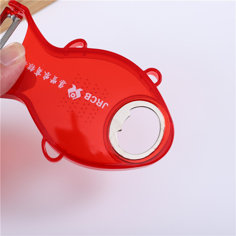 Fish-shaped stainless steel fruit peeler, transparent