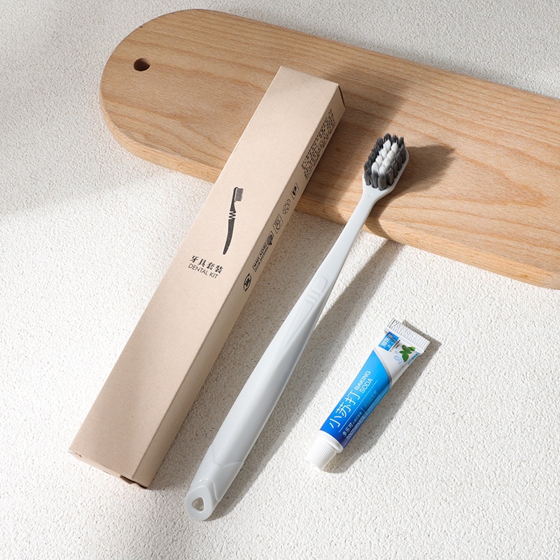 Disposable hotel toothbrush set with toothpaste, soft bristles, eco-friendly packaging