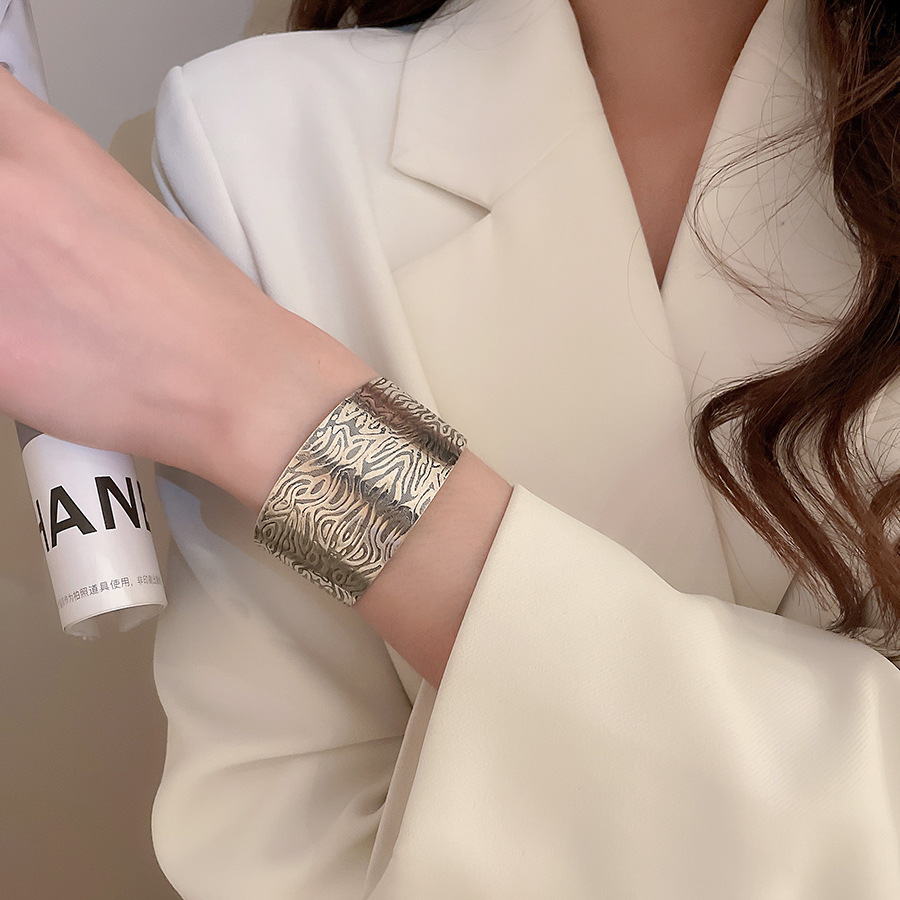 Metal geometric open bangle, gold tone