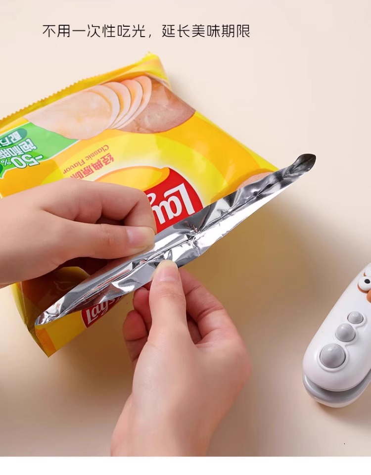 Mini hand-press plastic bag sealing machine