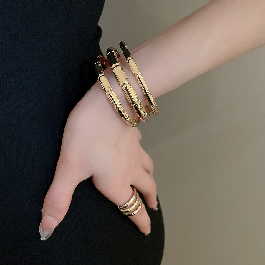Metal geometric open bangle, gold tone