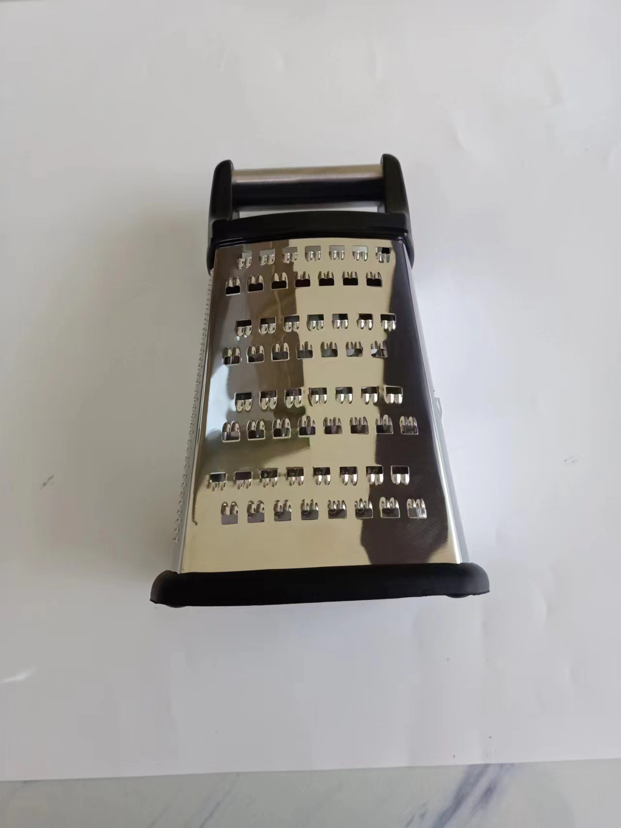 Multifunctional kitchen grater with handle and curved blade