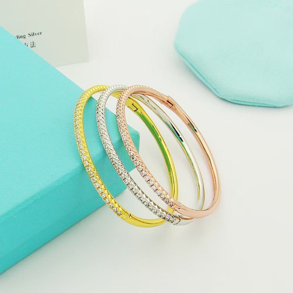 Gold-plated semi-circle bracelet with single row crystals