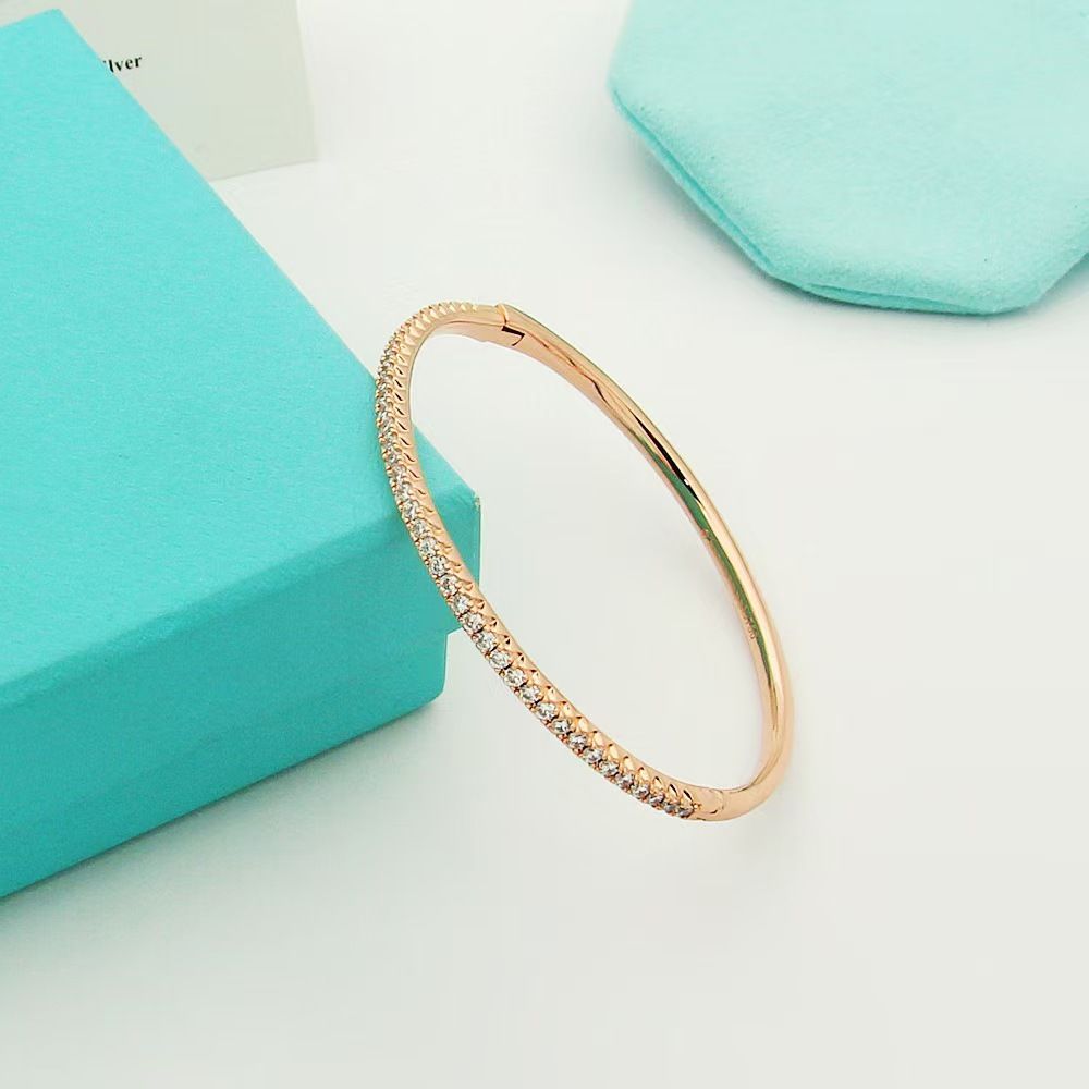 Gold-plated semi-circle bracelet with single row crystals