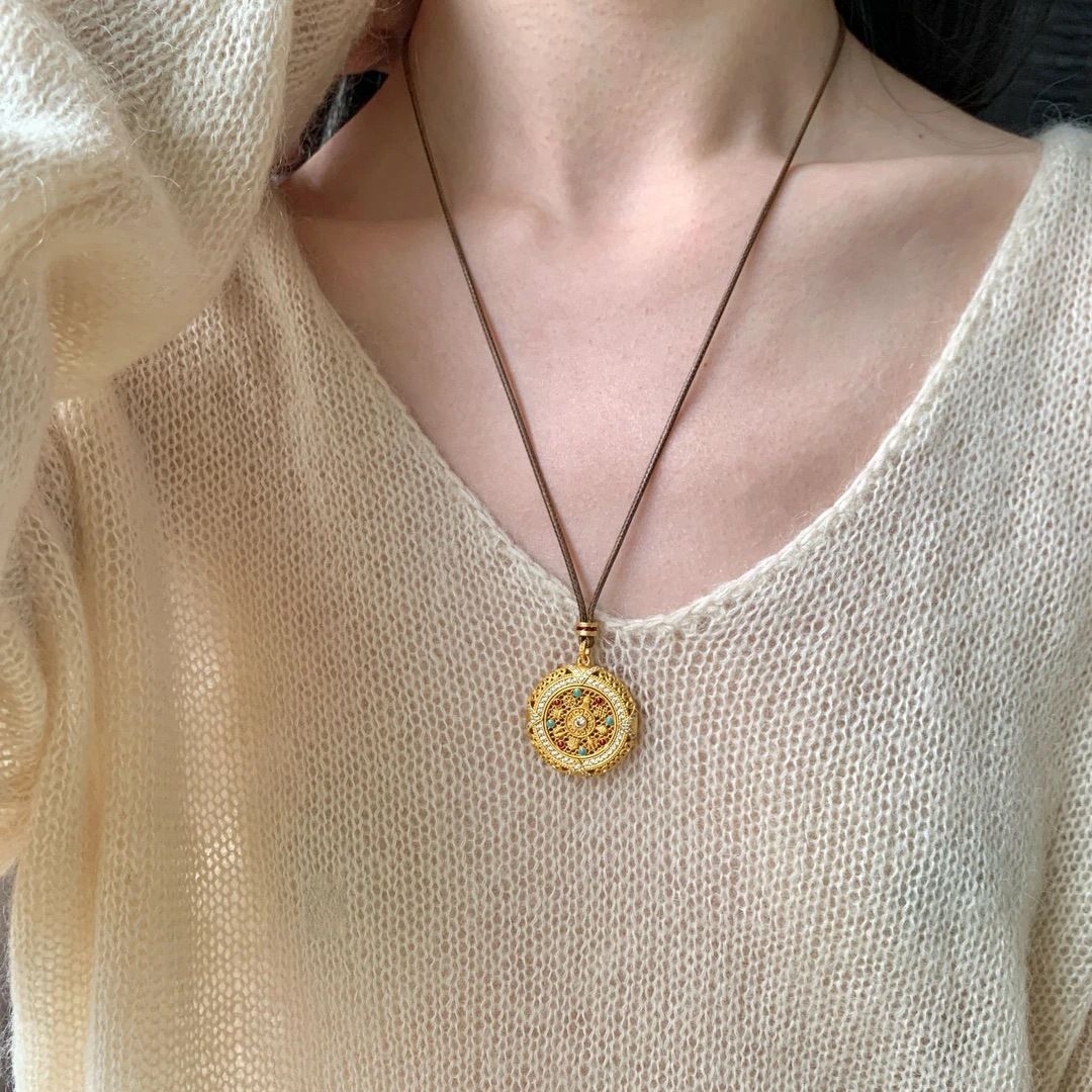 Silver rotatable Eight Treasures compass pendant, long sweater chain