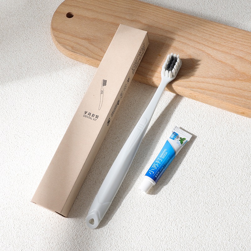 Disposable hotel toothbrush set with toothpaste, soft bristles, eco-friendly packaging