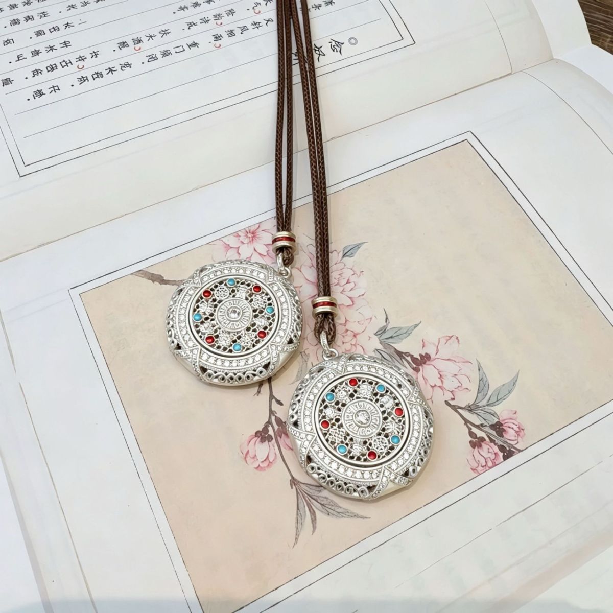 Silver rotatable Eight Treasures compass pendant, long sweater chain