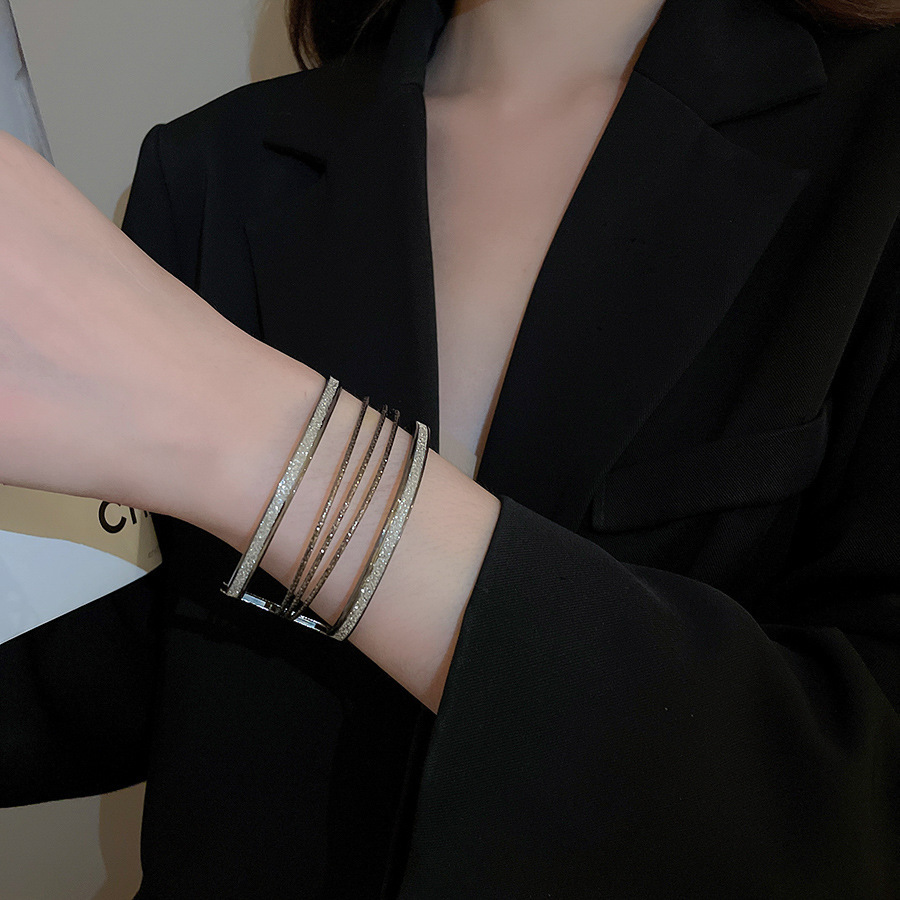 Metal geometric open bangle, gold tone