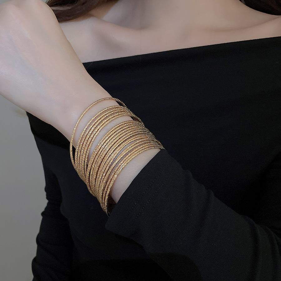 Metal geometric open bangle, gold tone