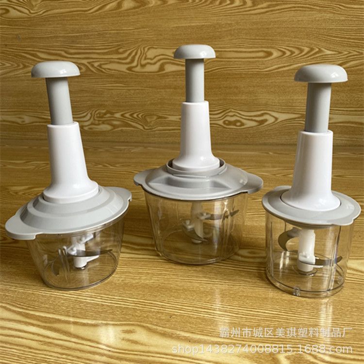 Hand-operated vegetable chopper for home kitchen use