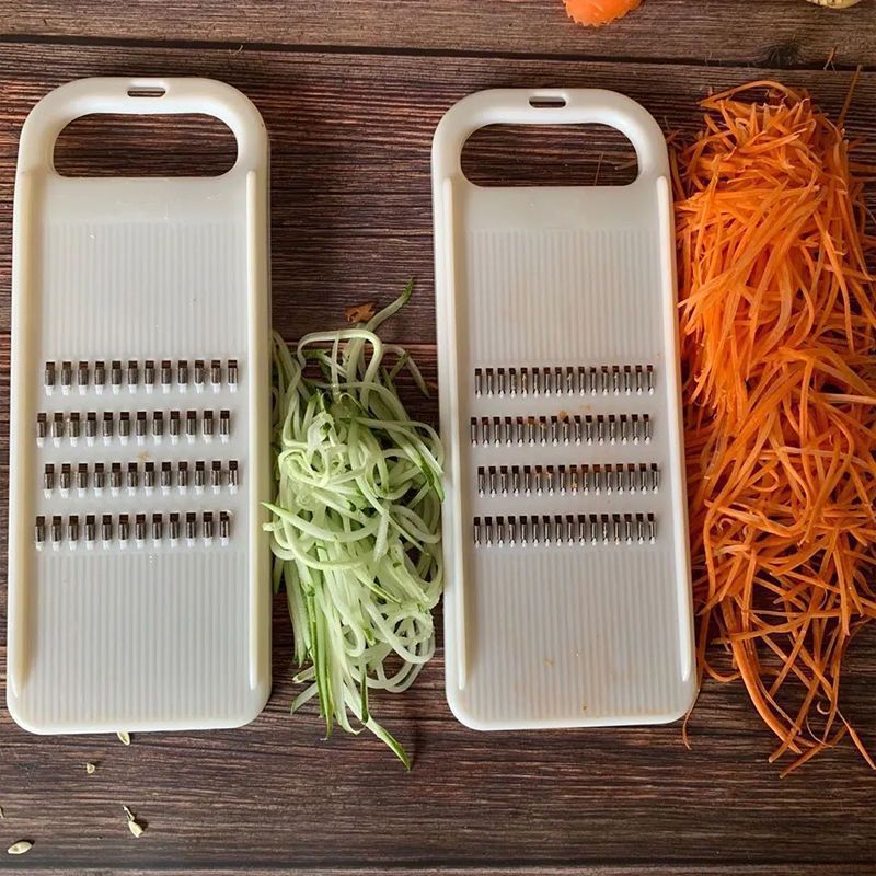 Vegetable shredder with hand guard, potato and cucumber slicer