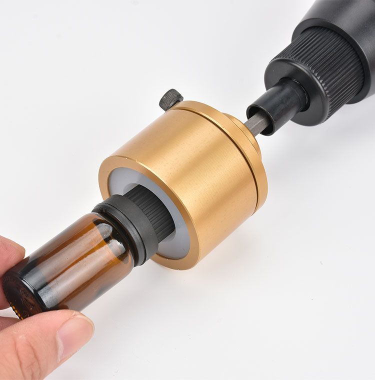 Electric bottle capping machine for glass bottles