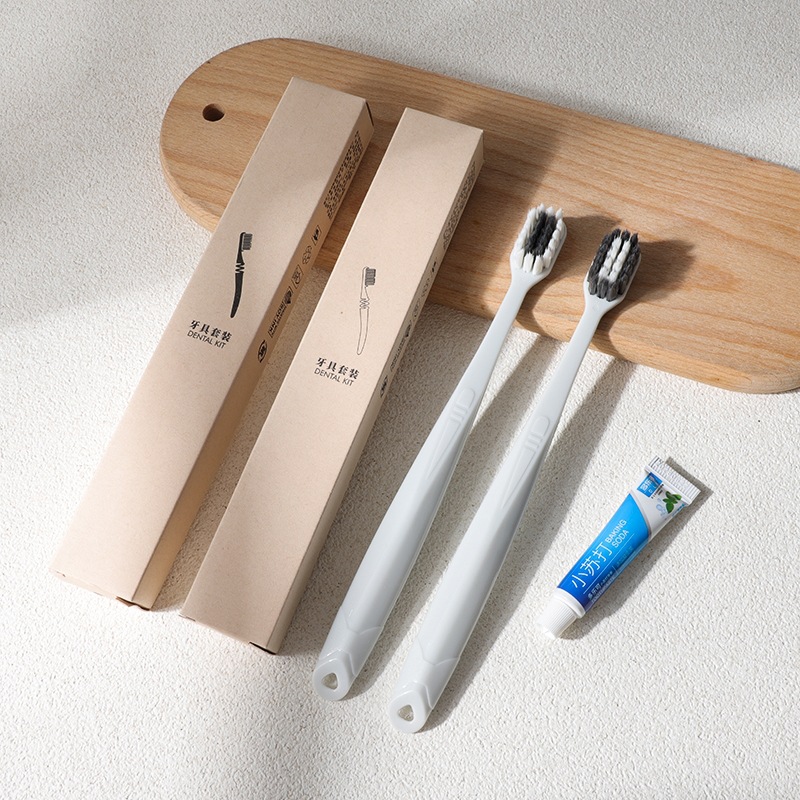 Disposable hotel toothbrush set with toothpaste, soft bristles, eco-friendly packaging