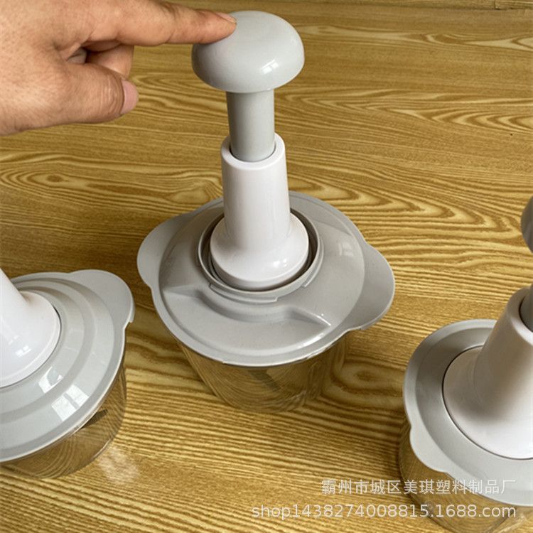Hand-operated vegetable chopper for home kitchen use