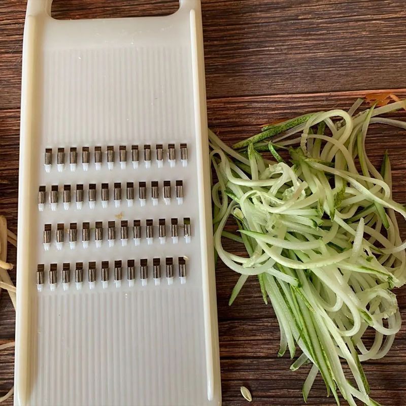 Vegetable shredder with hand guard, potato and cucumber slicer