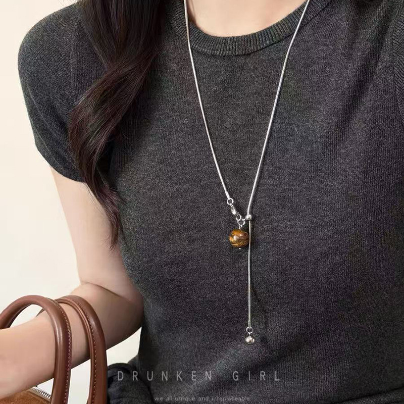 Round ring pendant necklace, black cord, long chain style