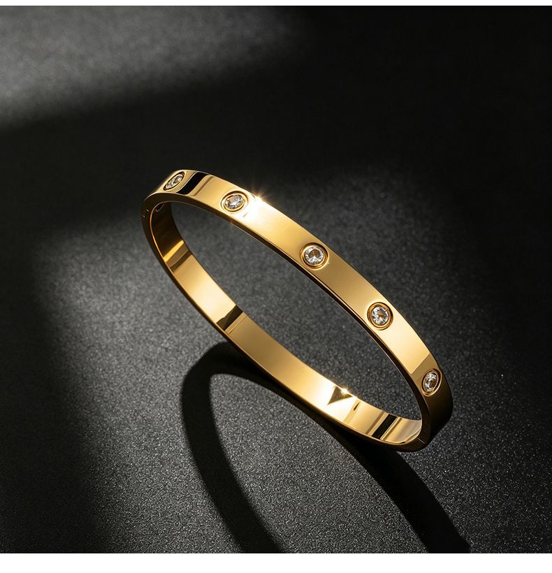 Titan-Stahl Armband, 18K vergoldet, 10 Steine mit Schiebeknoten