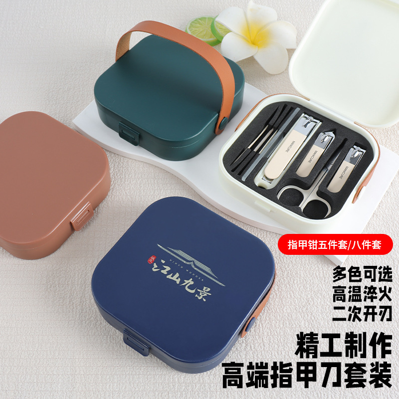 Nail clipper set with anti-splash angled blades