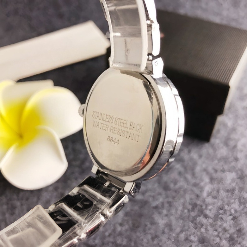 Women's quartz watch with stone accents, round open dial, pink