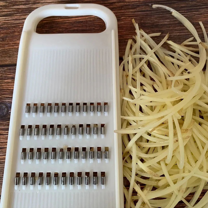 Vegetable shredder with hand guard, potato and cucumber slicer