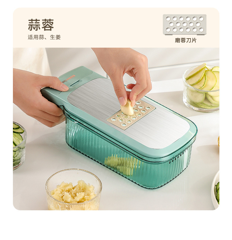 Vegetable cutter and grater with hand guard slicer function