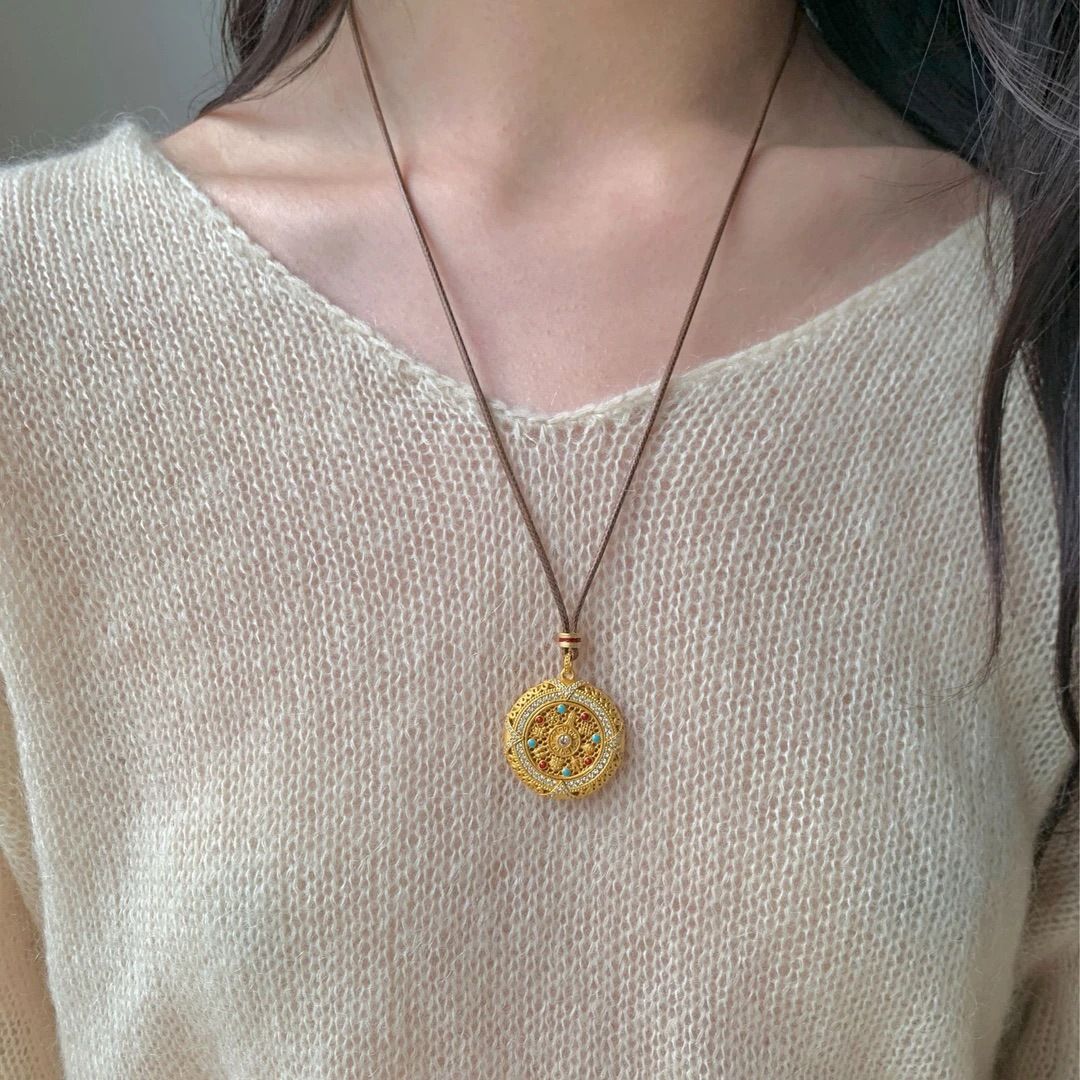 Silver rotatable Eight Treasures compass pendant, long sweater chain