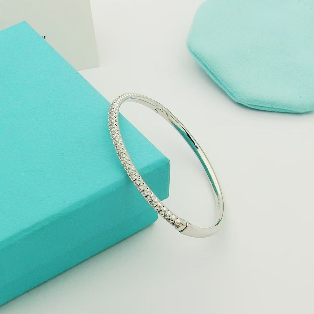 Gold-plated semi-circle bracelet with single row crystals