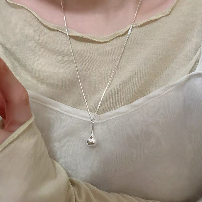 Round ring pendant necklace, black cord, long chain style