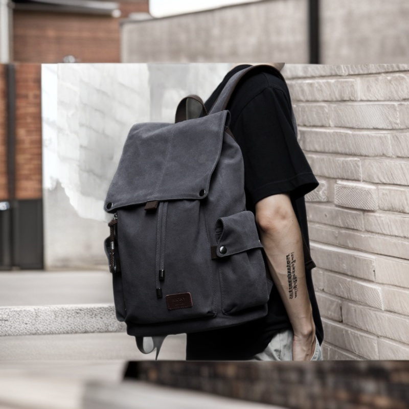 Large capacity men's canvas backpack with laptop compartment, for travel and school