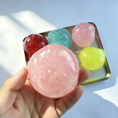 Vaseline-Perlen Knautschball, langsam rückstellend, bunte flache Perlen - 8