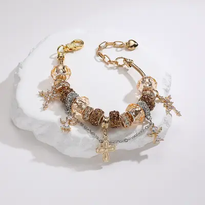 Gold-tone cross and angel charm adjustable women's bracelet