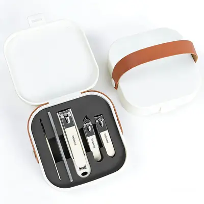 Nail clipper set with anti-splash angled blades