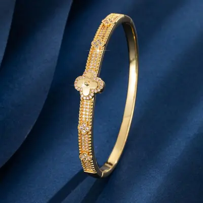 Vierblatt-Blüten-Kupferarmband, vergoldet, mit Zirkonia besetzt - 1