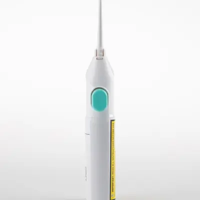 Portable manual water flosser oral irrigator