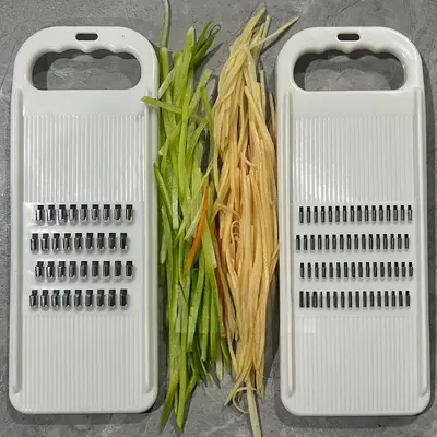 Vegetable shredder with hand guard, potato and cucumber slicer