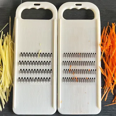 Vegetable shredder with hand guard, potato and cucumber slicer