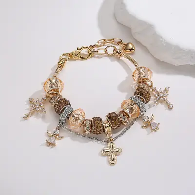 Gold-tone cross and angel charm adjustable women's bracelet