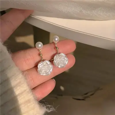Camellia pearl earrings with rose flower design