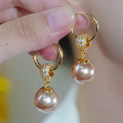 Bestseller-Ohrringe mit vollständig besetzten Strass in Champagnerfarbe, Perlendesign, Nischendesign, hochwertige Ohrklemmen, elegante und einzigartige Ohrhänger, stilvolle Ohraccessoires