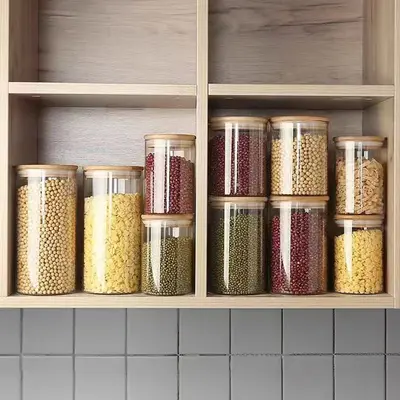 Hersteller Großhandel mit hohem Borosilikatglas, versiegeltes Glas, Aufbewahrungsflasche, Süßigkeiten-Aufbewahrungsglas, gerades Rohr, Teeglas, Bambusdeckel, Teeglas