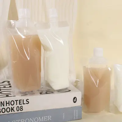 Tek kullanımlık şeffaf emzikli torba soya sütü torbası geleneksel Çin tıbbı sıvı ambalaj torbası meyve suyu içecek plastik torba yoğurt mühürlü torba