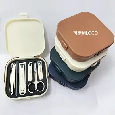 Nail clipper set with anti-splash angled blades